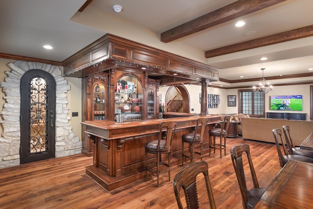 21 Forest Ave, Naperville, IL 60540 - indoor dry bar with a chandelier, ornamental molding, hardwood / wood-style flooring, beam ceiling, and pendant lighting