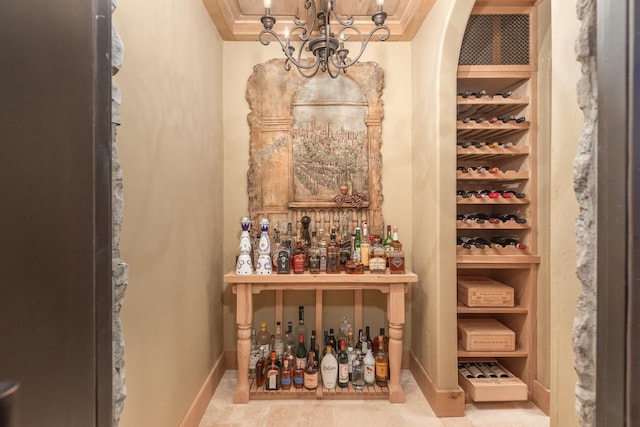 21 Forest Ave, Naperville, IL 60540 - wine cellar with a chandelier, baseboards, and crown molding