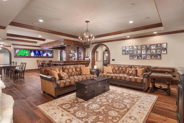 21 Forest Ave, Naperville, IL 60540 - living room featuring arched walkways, a raised ceiling, crown molding, dark wood finished floors, and recessed lighting