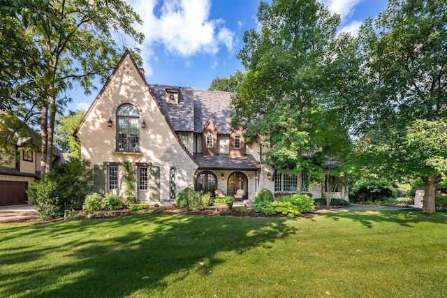 21 Forest Ave, Naperville, IL 60540 - english style home featuring a front yard, stucco siding, a high end roof, and stone siding