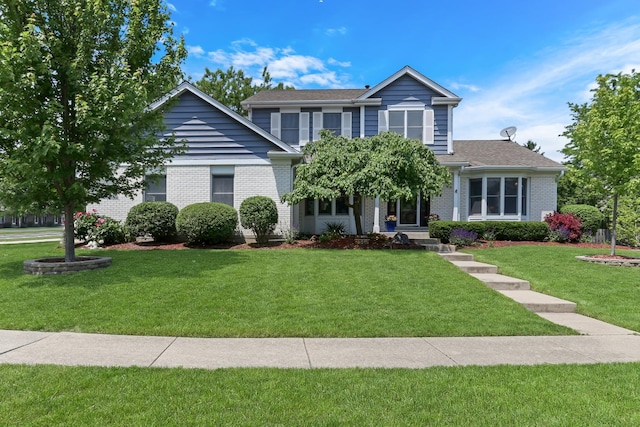 347 Yorkshire Dr, Mundelein, IL 60060 - view of front facade with a front lawn and brick siding