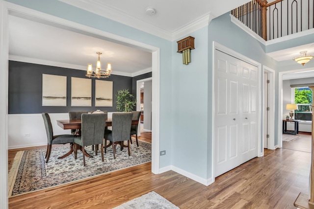 347 Yorkshire Dr, Mundelein, IL 60060 - dining area with a chandelier, wood finished floors, baseboards, and crown molding
