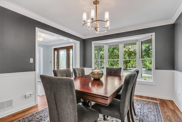 347 Yorkshire Dr, Mundelein, IL 60060 - dining area with a chandelier, wood finished floors, ornamental molding, and baseboards