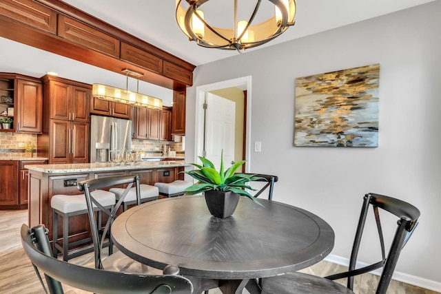 347 Yorkshire Dr, Mundelein, IL 60060 - dining area featuring a chandelier and baseboards