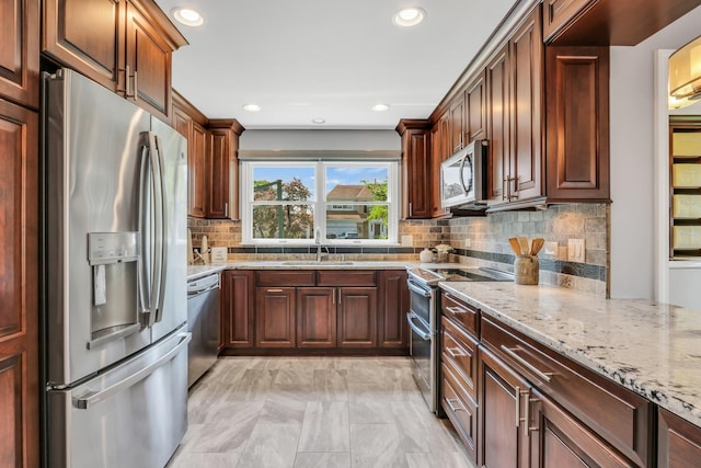 347 Yorkshire Dr, Mundelein, IL 60060 - kitchen with stainless steel appliances, a sink, light stone countertops, and recessed lighting