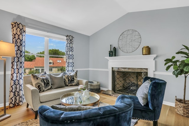347 Yorkshire Dr, Mundelein, IL 60060 - living area featuring lofted ceiling, a fireplace, wood finished floors, and baseboards