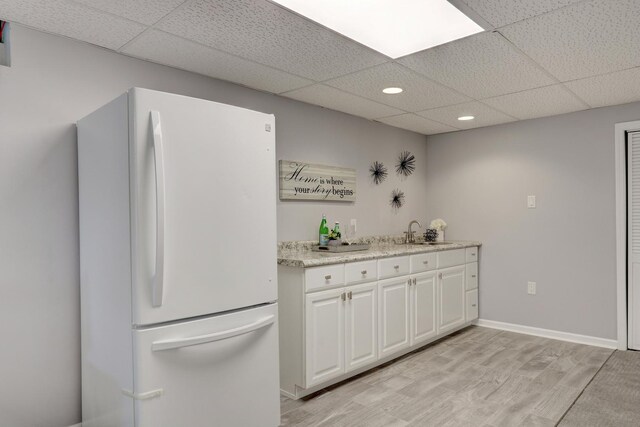 347 Yorkshire Dr, Mundelein, IL 60060 - kitchen with freestanding refrigerator, a paneled ceiling, a sink, recessed lighting, and white cabinets