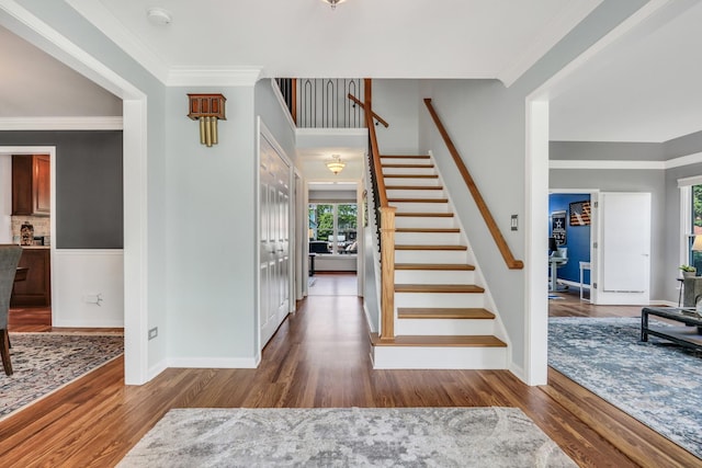 347 Yorkshire Dr, Mundelein, IL 60060 - entryway featuring plenty of natural light, wood finished floors, stairs, baseboards, and crown molding