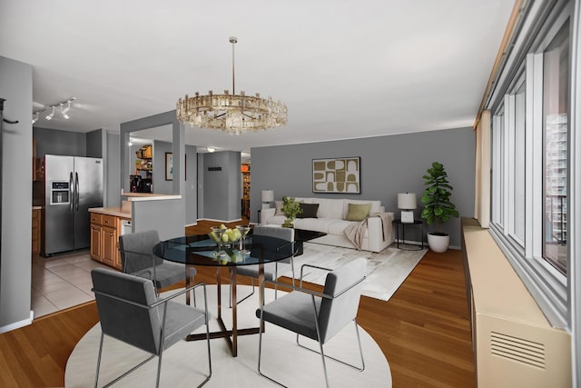 400 E Randolph St Unit 1825, Chicago, IL 60601 - dining area featuring light wood-style floors and a chandelier