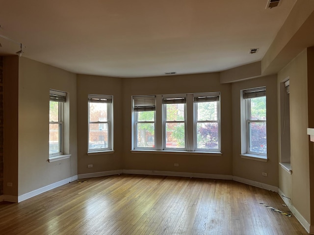 7513 N Winchester Ave Unit 1, Chicago, IL 60626 - unfurnished room featuring light wood-style floors and baseboards