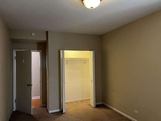 7513 N Winchester Ave Unit 1, Chicago, IL 60626 - unfurnished bedroom with carpet floors, a closet, and baseboards