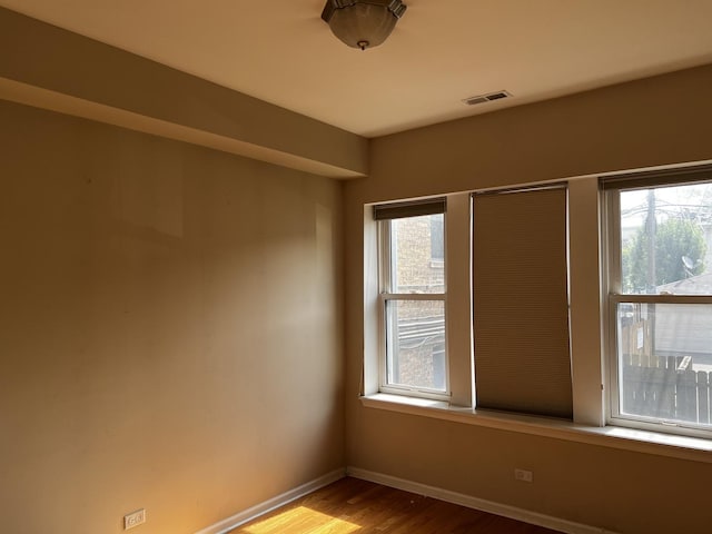7513 N Winchester Ave Unit 1, Chicago, IL 60626 - empty room featuring wood finished floors and baseboards
