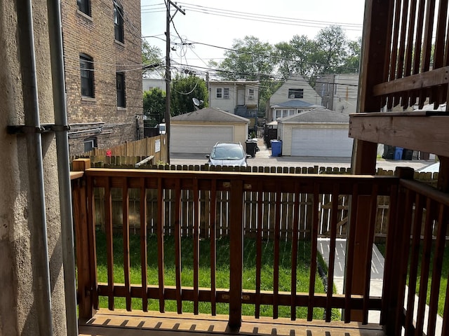 7513 N Winchester Ave Unit 1, Chicago, IL 60626 - deck featuring area for grilling, a garage, and a residential view