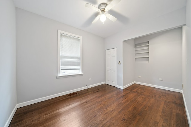 4646 W Montana St, Chicago, IL 60639 - unfurnished bedroom featuring dark wood finished floors, baseboards, a closet, and a ceiling fan