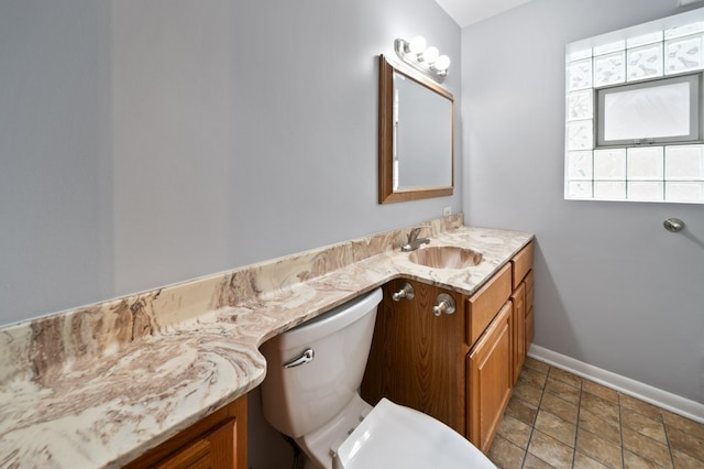 4646 W Montana St, Chicago, IL 60639 - half bathroom featuring vanity, baseboards, and toilet