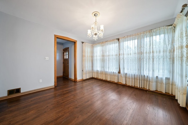4646 W Montana St, Chicago, IL 60639 - spare room featuring a chandelier, wood finished floors, and baseboards