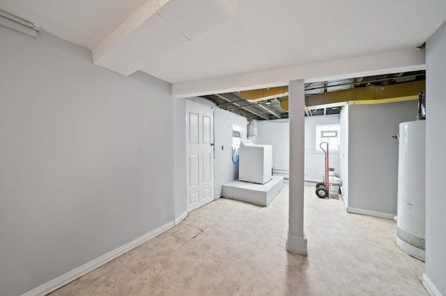 4646 W Montana St, Chicago, IL 60639 - below grade area with washer / clothes dryer, water heater, and baseboards