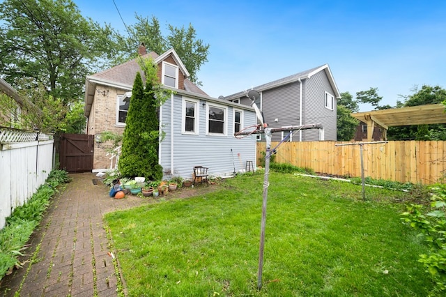 4646 W Montana St, Chicago, IL 60639 - back of house with a chimney and a gate