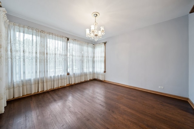 4646 W Montana St, Chicago, IL 60639 - empty room with a chandelier, wood finished floors, and baseboards