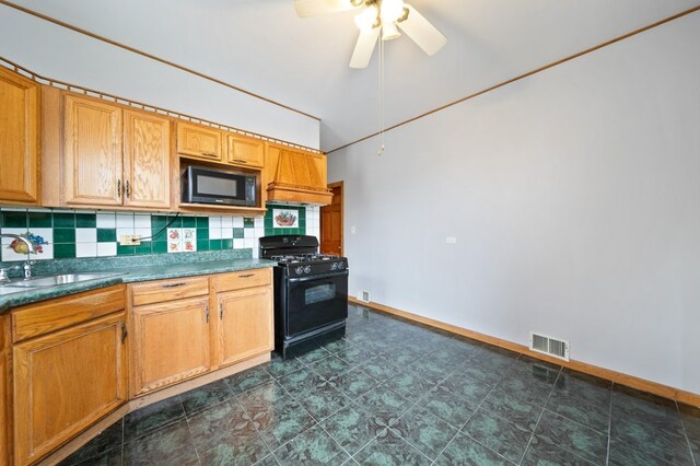 4646 W Montana St, Chicago, IL 60639 - kitchen featuring black appliances, a sink, tasteful backsplash, and a ceiling fan