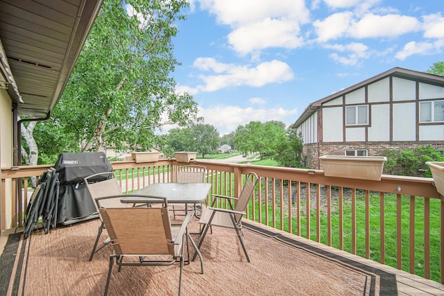 213 Vine St Unit 3, New Lenox, IL 60451 - wooden deck featuring outdoor dining area, a grill, and a lawn