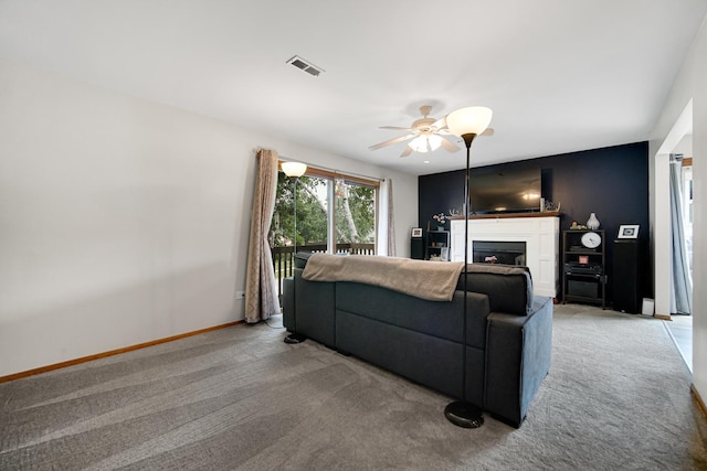 213 Vine St Unit 3, New Lenox, IL 60451 - living area with light colored carpet, a fireplace, ceiling fan, and baseboards