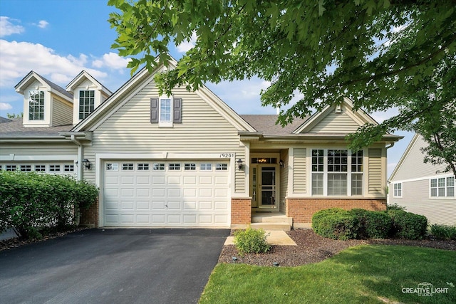 1920 Glenwood Cir Unit B, Sugar Grove, IL 60554 - view of front of home featuring driveway, brick siding, and a garage