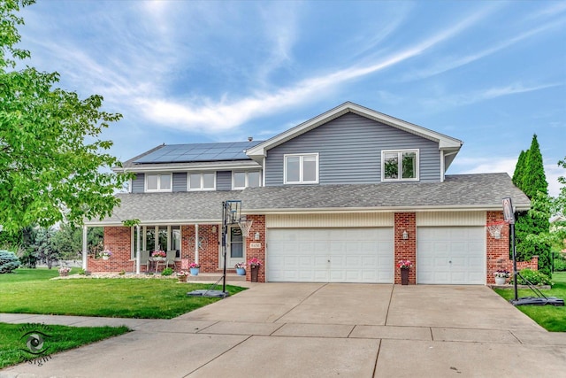 8456 Meadows Edge Trl, Tinley Park, IL 60487 - view of front of property with brick siding, concrete driveway, a front lawn, and a garage