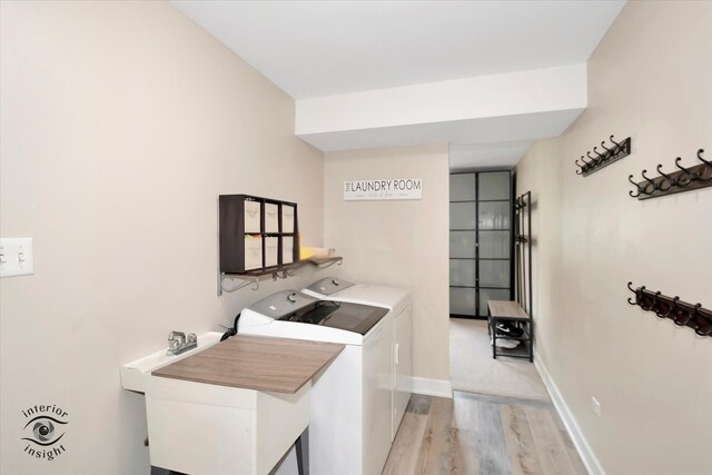 8456 Meadows Edge Trl, Tinley Park, IL 60487 - laundry room featuring washing machine and clothes dryer and light wood-style flooring