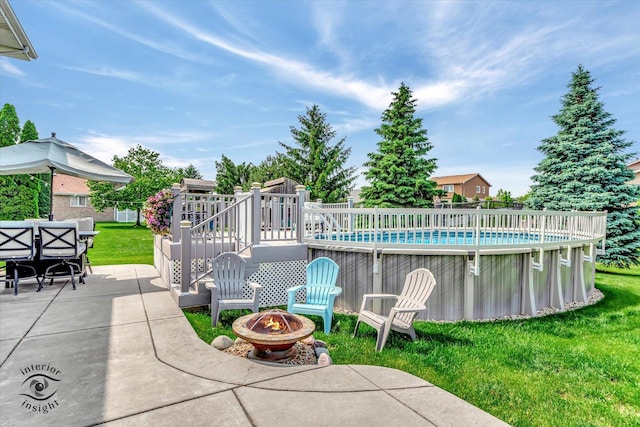 8456 Meadows Edge Trl, Tinley Park, IL 60487 - outdoor pool with a fire pit, a lawn, a patio area, and a wooden deck