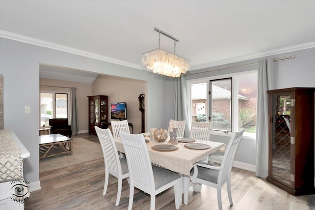 8456 Meadows Edge Trl, Tinley Park, IL 60487 - dining room featuring ornamental molding, light wood-style flooring, a chandelier, and plenty of natural light