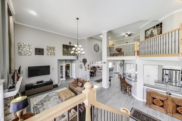 27117 Ashgate Xing, Plainfield, IL 60585 - living area featuring wood finished floors, crown molding, a ceiling fan, and a chandelier