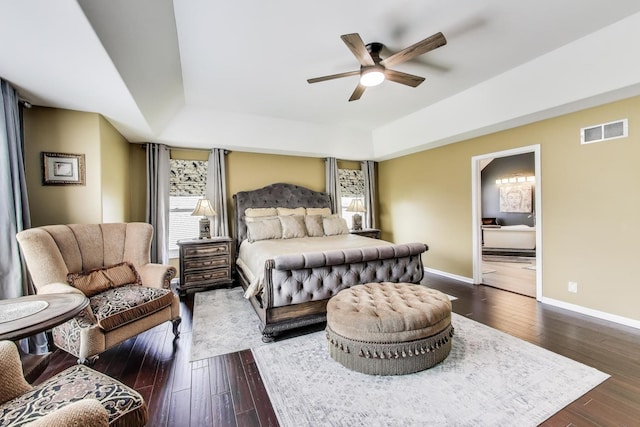 27117 Ashgate Xing, Plainfield, IL 60585 - bedroom with hardwood / wood-style flooring, a tray ceiling, and a ceiling fan