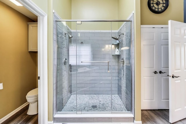 27117 Ashgate Xing, Plainfield, IL 60585 - bathroom featuring wood finished floors and a shower stall