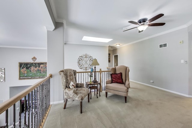 27117 Ashgate Xing, Plainfield, IL 60585 - sitting room featuring a skylight, ceiling fan, carpet floors, and ornamental molding