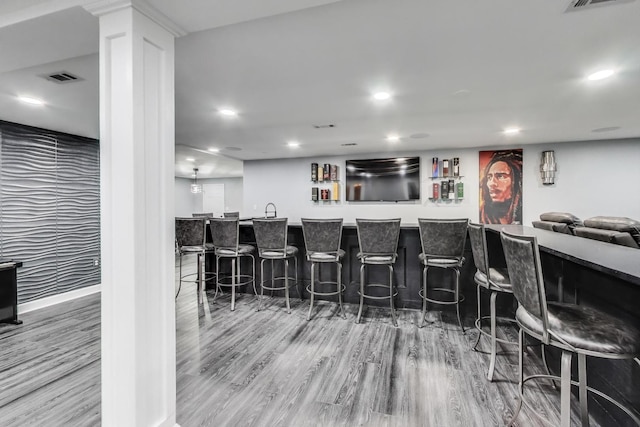 27117 Ashgate Xing, Plainfield, IL 60585 - indoor wet bar featuring wood finished floors and recessed lighting