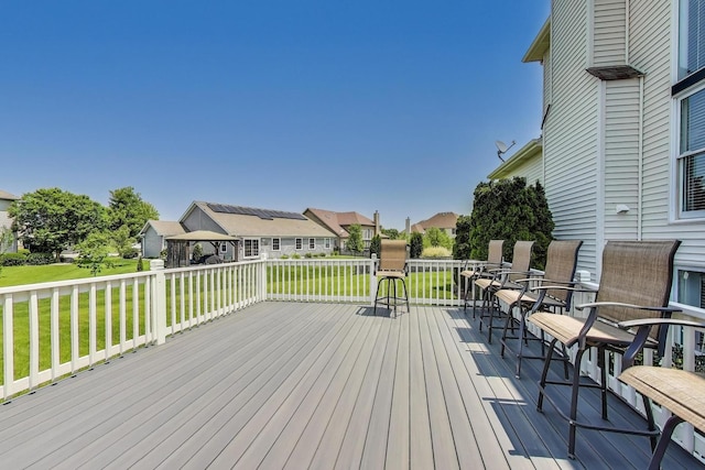 27117 Ashgate Xing, Plainfield, IL 60585 - wooden terrace with a lawn and a residential view