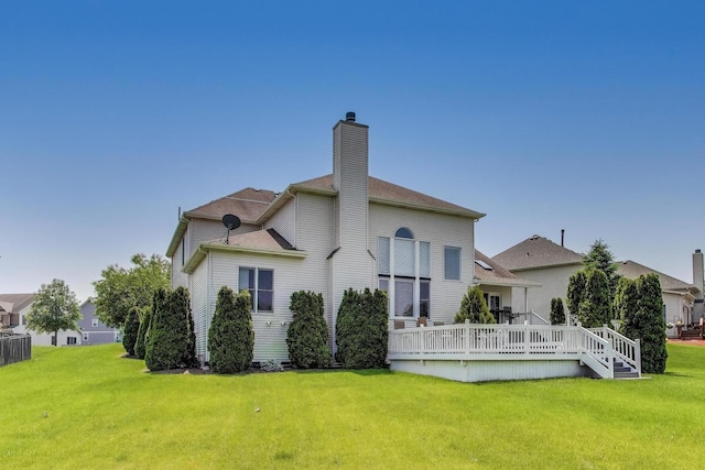 27117 Ashgate Xing, Plainfield, IL 60585 - back of house featuring a yard, a chimney, and a wooden deck