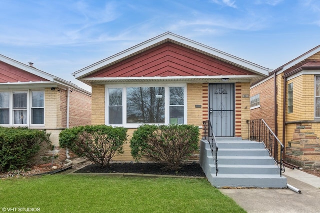 3411 W 59th St, Chicago, IL 60629 - view of front of house featuring a front lawn and brick siding