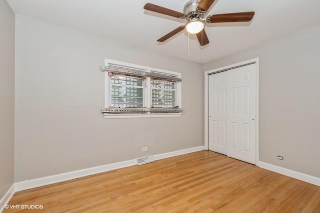 3411 W 59th St, Chicago, IL 60629 - unfurnished bedroom featuring light wood-style flooring, baseboards, a closet, and a ceiling fan