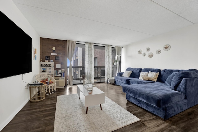11 W Green St Unit 502, Bensenville, IL 60106 - living area featuring dark wood-type flooring and baseboards