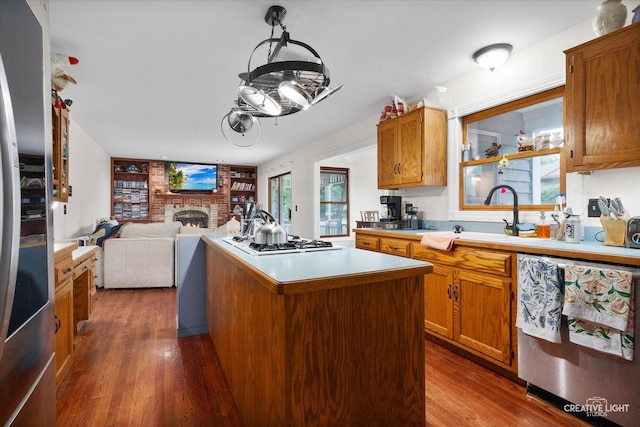925 Merrill New Rd, Sugar Grove, IL 60554 - kitchen with appliances with stainless steel finishes, a fireplace, light countertops, and dark wood-style floors