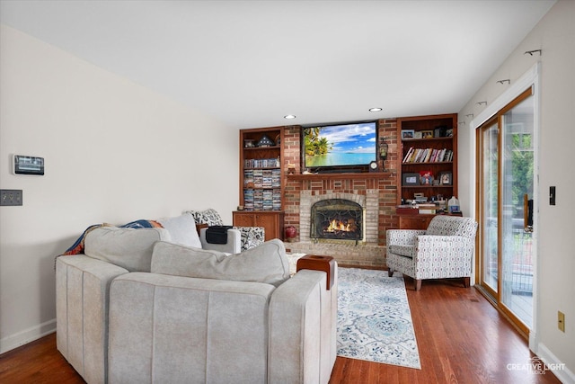 925 Merrill New Rd, Sugar Grove, IL 60554 - living room with built in shelves, wood finished floors, a brick fireplace, and recessed lighting