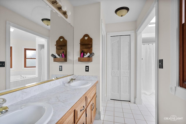 925 Merrill New Rd, Sugar Grove, IL 60554 - bathroom featuring tile patterned floors, double vanity, a closet, and a bathtub