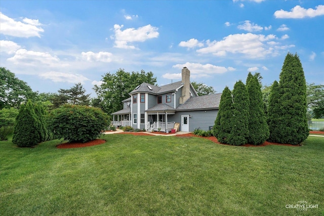 925 Merrill New Rd, Sugar Grove, IL 60554 - rear view of house featuring a lawn and a chimney