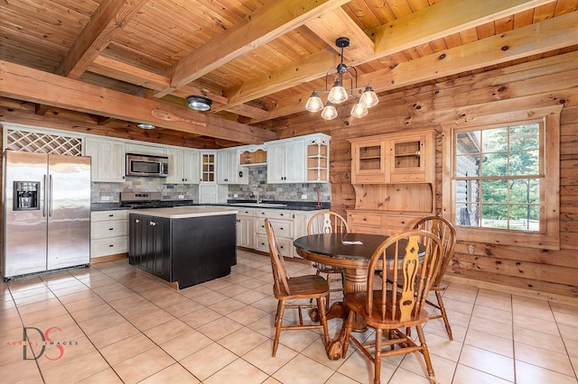 2622 E 28th Rd, Marseilles, IL 61341 - dining space featuring a wood ceiling with exposed beams, light tile patterned floors, wooden walls, and a chandelier