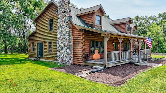 2622 E 28th Rd, Marseilles, IL 61341 - view of front of home with a porch, log exterior, a front yard, and a chimney