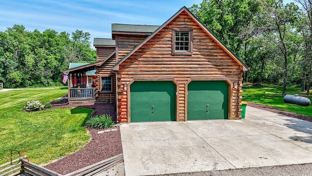 2622 E 28th Rd, Marseilles, IL 61341 - view of front of property with log siding, a front yard, a garage, and a porch