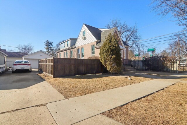 1280 White St, Des Plaines, IL 60018 - view of side of home featuring brick siding and a detached garage