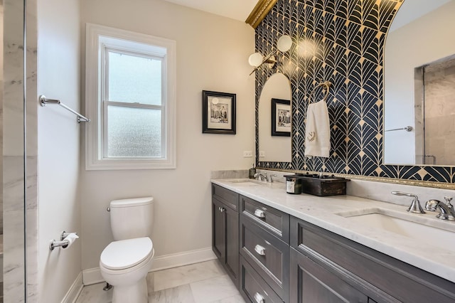2700 N Wayne Ave Unit 2N, Chicago, IL 60614 - full bathroom with toilet, double vanity, baseboards, and marble look tiles